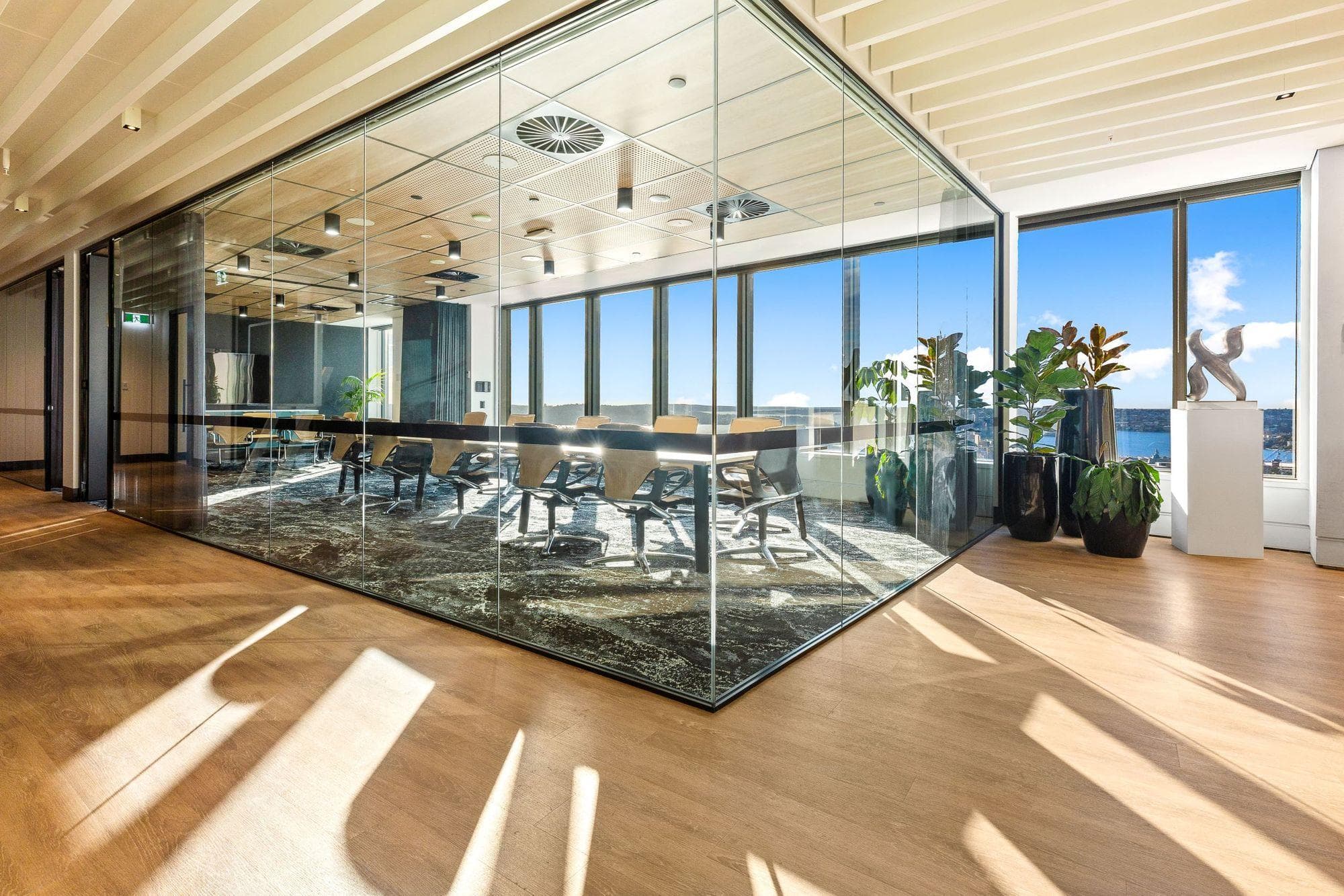 Modern conference room interiors featuring executive meeting tables, ergonomic seating, advanced AV technology, acoustic solutions, and premium corporate office designs.